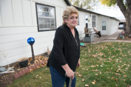Dawn Stein outside her home in Triple Creek neighborhood, Greeley, Colorado. The access road to the new oil and gas development will be 35 feet from her bedroom window. (Ted Wood/The Story Group)