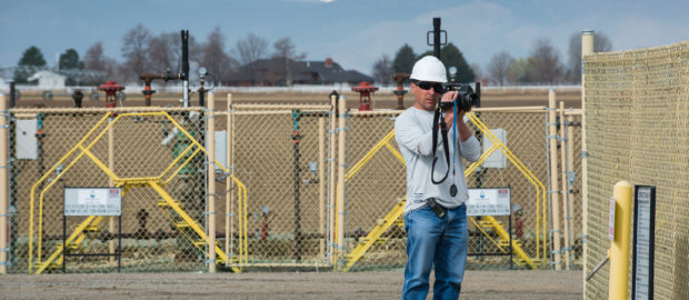 Patrick Murphy, Boulder County Public Health employee, uses a FLIR infrared camera to check for gas leaks at a operating well pad in eastern Boulder County. (Photo by Ted Wood/The Story Group.)